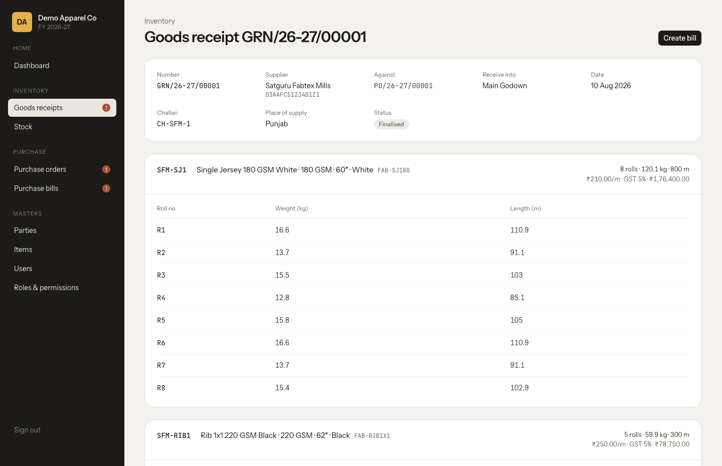 Goods receipt showing fabric rolls with weight and length per roll, supplier GSTIN and GST totals
